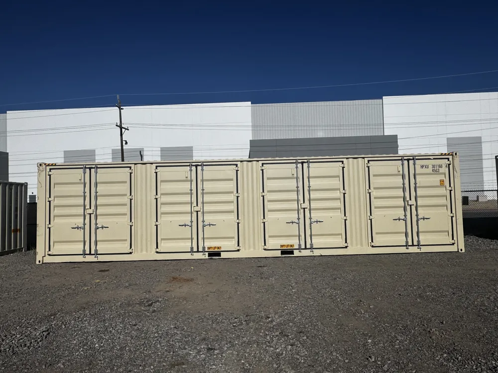 A new tan high-cube shipping container in the ContainerNV yard under a clear blue sky